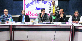 Industry minster Mukesh Agnihotri presides over a meeting of the district grievances redressal committee at Una on Monday.