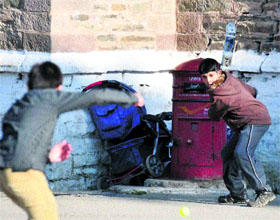 Children play cricket on the Ridge in Shimla on Monday.