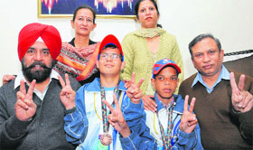 Differently abled children, Ishwinder and Vivek Aggarwal, with their parents in Jalandhar.