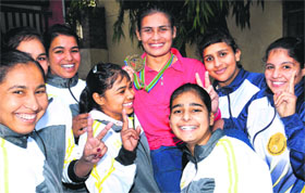 Preeti in a jubilant mood with her teammates in Jalandhar.