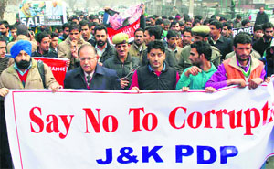 Members of the Peoples Democratic Party take out a protest march in Srinagar on Monday.