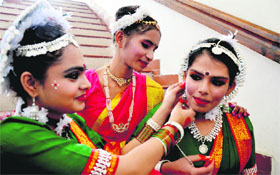 Students of BCM School get ready to perform during their annual prize distribution function in Ludhiana on Monday.