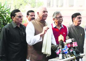 BJP Leaders Yashwant Sinha, Gopinath Munde and CPI leader Gurudas Dasgupta talk to the media in New Delhi on Monday