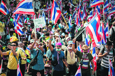 Protesters gather outside the the Government House in Bangkok on Monday.