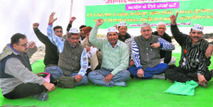 Jantantra Morcha members hold a demonstration in support of Anna Hazare in Dehradun on Tuesday. 