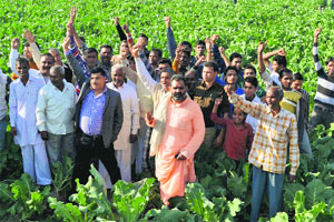 BJP legislator from rural segment Swami Yatishwaranand along with villagers support the demand for an NDRF battalion at Sarai village in Haridwar on Tuesday.