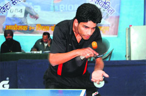 A player in action in a match in the Youth District-Level Table Tennis Championship in Dehradun on Tuesday.
