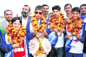 Differently abled athletes and sportspersons from Haryana show the medals won at the Special Olympics in Australia during a felicitation ceremony in Rohtak