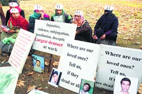 Relatives of disappeared persons stage a silent protest on World Human Rights Day in Srinagar on Tuesday