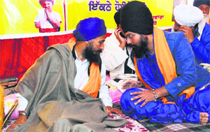 Gurbaksh Singh Khalsa (left) outside the Gurdwara Amb Sahib in Mohali on Tuesday