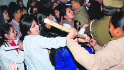 Police use force on the protesting students of Shri Dhanwantry Ayurvedic College at Panjab University on Wednesday. Tribune photo: Manoj Mahajan