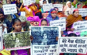 Activists from the Bhopal Gas Peerit Sangharsh Sahyog Samiti hold placards during a demonstration, demanding justice for the gas tragedy victims, at Jantar Mantar in New Delhi on Wednesday