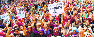 Residents stage a protest against development charges in Rohtak on Tuesday. 