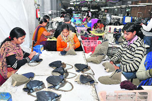 Workers busy at a unit in Tahliwal industrial area.