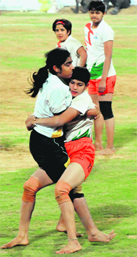 A Pakistani player tackles an Indian opponent in Bathinda.