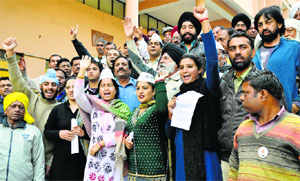 Activists of the Aam Aadmi Party hold a protest in Ludhiana on Wednesday.