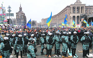 Pro-European integration protesters being stopped by the police at Independence Square in Kiev on Wednesday.