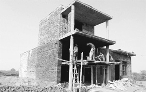 An illegal structure coming up on shamlat land on the Mukandpur-Togan road near Dera Bassi. 