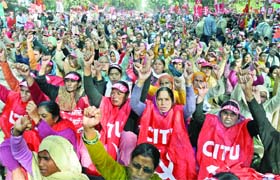 Workers from different states participate in a massive rally against the economic policies of the government, price rise and corruption, under the banner of All India Trade Union Congress (AITUC) at Jantar Mantar in New Delhi on Thursday