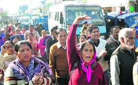 Statehood agitators protest in support of their demands at Prince Chowk in Dehradun on Thursday.