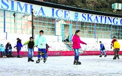 Children enjoy at the ice skating rink in Shimla on Thursday. Photo: Amit Kanwar