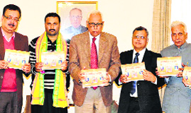 Governor NN Vohra releases the 14th edition of Raghvendra Panchang in Jammu on Thursday.