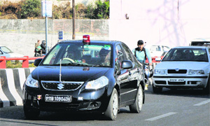 An Army vehicle with a red beacon plies on a road in Jammu on Thursday.
