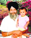 Detainee Lal Singh with his child. A file photograph