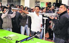 Vijay Kumar and Gagan Narang, both medallists in the London Olympics, during a promotional event on Thursday. PTI