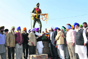 Members of Sainik wing of SAD pay tributes to Baba Nand Singh Fauji on the occasion of his 66th death anniversary in Bathinda on Friday. 