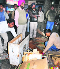 MC officials remove encroachments at Sector 27 in Chandigarh on Friday.