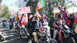 The BJP youth wing workers take out a rally to muster support for Narendra Modi in Mussoorie on Friday. A Tribune photograph