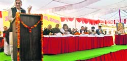 Chief Minister Vijay Bahuguna addresses a convention of the Uttarakhand Madhyamaik Shikshak Sangh at Hindu National Inter-College in Dehradun on Friday. A Tribune photograph