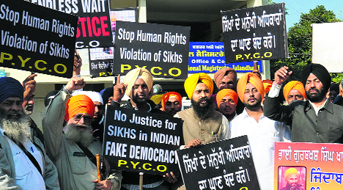 Activists of the Punjab Youth Clubs Organisation stage a protest for their demands outside DC's office in Jalandhar on Friday.