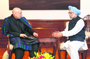 PM Manmohan Singh (R) and Afghan President Hamid Karzai in New Delhi on Friday. Karzai is on a four-day official visit to India till December 15.