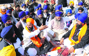 Gurbaksh Khalsa with his supporters at Gurdwara Amb Sahib, Mohali, on Friday.
