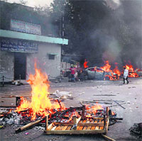 Vehicles and roadblocks set on fire by activists of Islamist party Jamaat-e-Islami following the execution of their party leader Abdul Quader Mollah in Dhaka on Friday. 