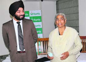 Dr Harsimran Singh, Director, Orthopaedics and Joint Replacement, Fortis Hospital, with his patient Agya Kaur in Bathinda on Saturday