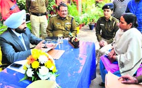 New UT SSP Sukchain Singh Gill takes up the queries of a complainant at the Sector 26 police station in Chandigarh
