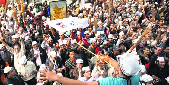 AAP activists erupt in joy following the partys astounding win in the Delhi elections. The pro-AAP wave in Delhi went unnoticed by Congress and BJP leaders, who let their complacency get the better of them. Tribune photos: Mukesh Aggarwal