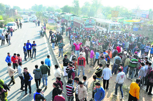 Students and residents hold a protest in Kathua district on Saturday. 