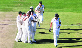 Australia players celebrate the dismissal of England's Kevin Pietersen during the second day of the third Ashes Test at the WACA ground in Perth on Saturday.