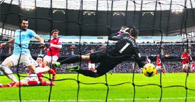 Manchester City's Alvaro Negredo scores against Arsenal during their English Premier League match in Manchester on Saturday.