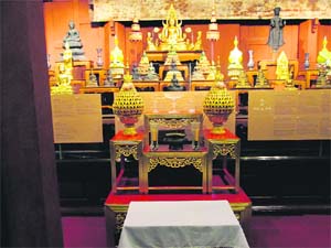 An imposing statue of Buddha inside a temple