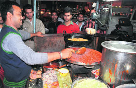 Lucky serves soup at his makeshift shop near Gole Diggi in Bathinda.