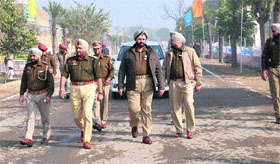 Senior police officials at Badal village ahead of the visit of Pakistan Punjabs Chief Minister Shahbaz Sharif on Sunday.