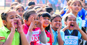 Students of Millennium School cheer their house members during the annual athletics meet.