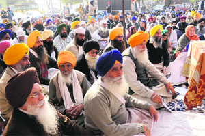 People gather in support of the hunger strike by Gurbaksh Singh Khalsa (from Haryana) on the premises of Gurdwara Amab Sahib, Phase VIII, in Mohali on Sunday.