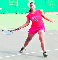 A player in action during the CLTA-AITA Championship Series Tennis Tournament at the CLTA, Sector 10, Chandigarh, on Sunday