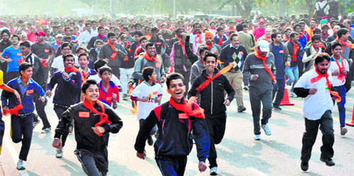 Residents participate in the Run for Unity race held at the Sukhna Lake in Chandigarh on Sunday. 